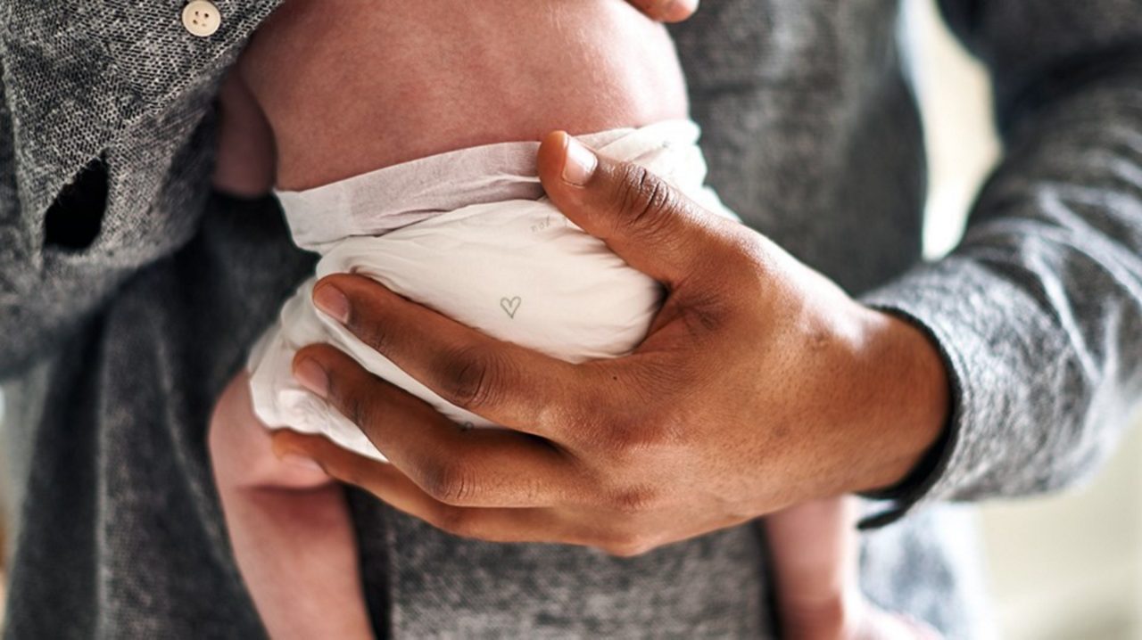 dad holding newborn baby