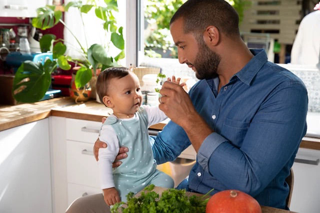 Dad and baby in kitchen