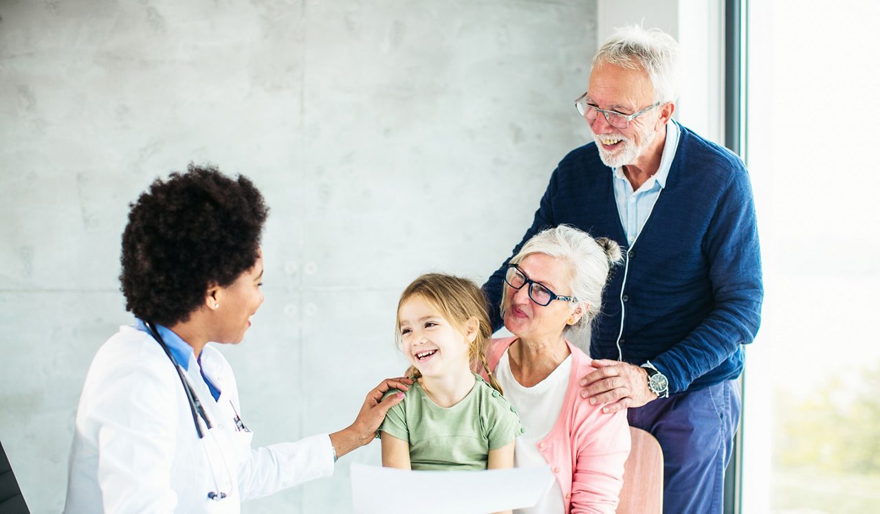 Female doctor working with senior patient in a modern office clinic / hospital