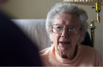 nutricia elderly lady sat in arm chair