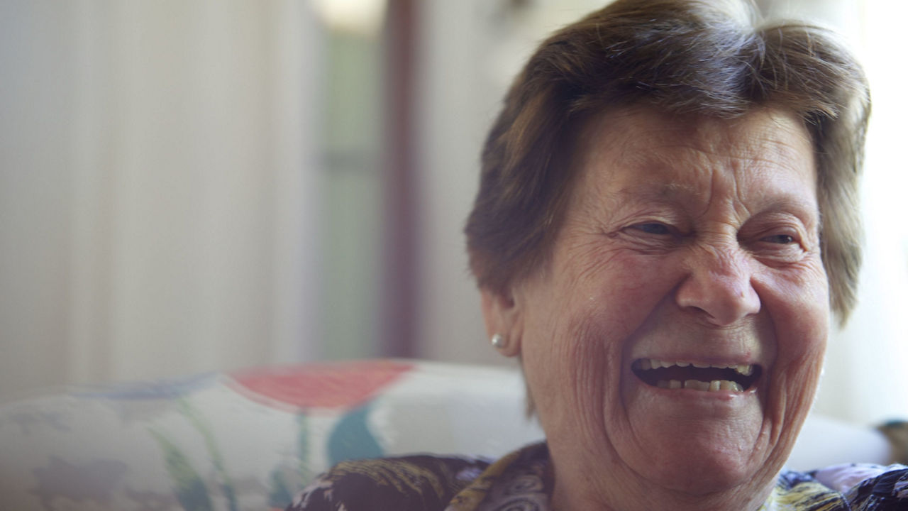 Elderly woman laughing