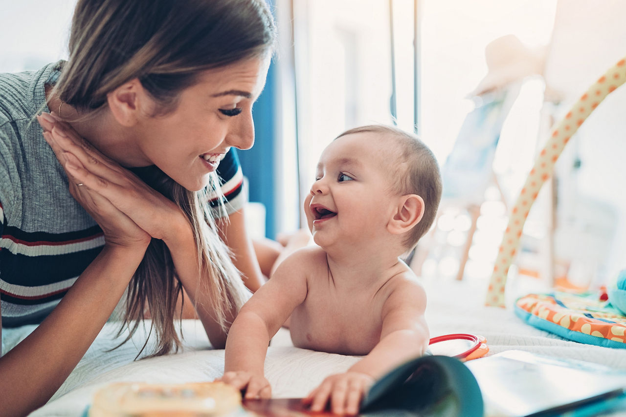 Mother playing with her baby