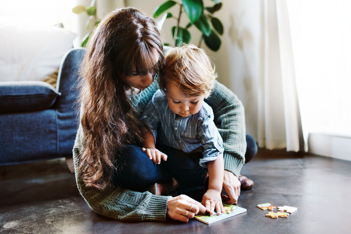 Cropped shot of a young woman spending quality time at home with her son