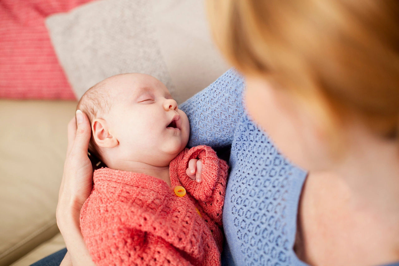 Mum holding baby