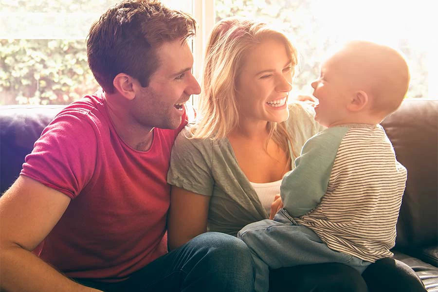 Family with a baby on sunlight