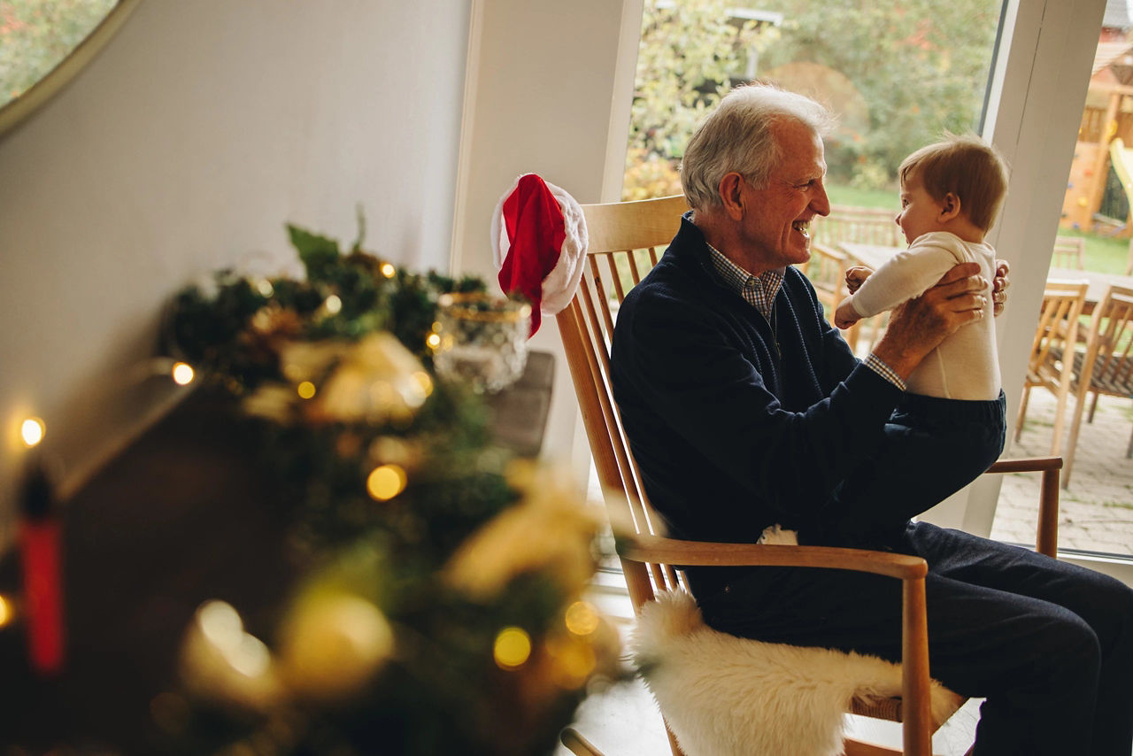 Grandparent and baby on christmas