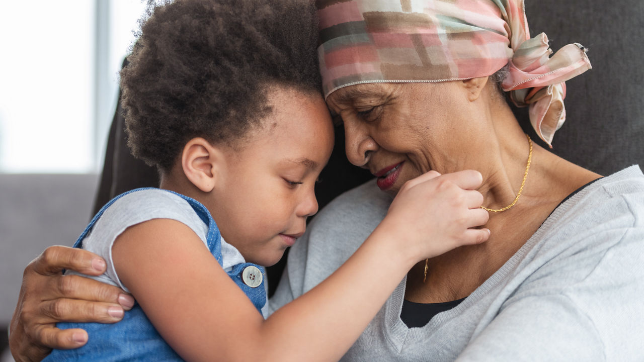 grandparent-and-child-heads-touching