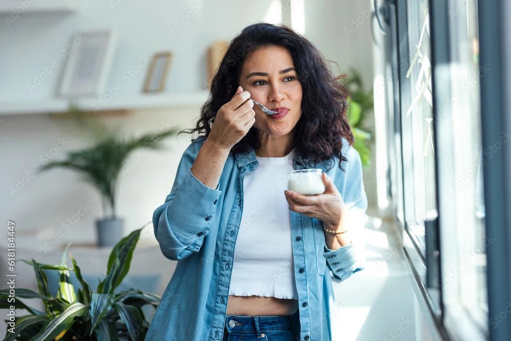 woman eating yoghurt