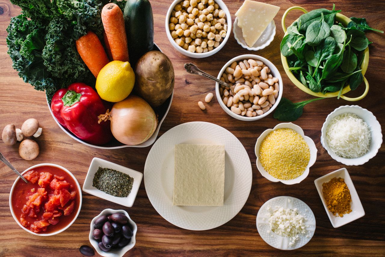 Vegetables, fruits, beans and other ingredients on table. From above