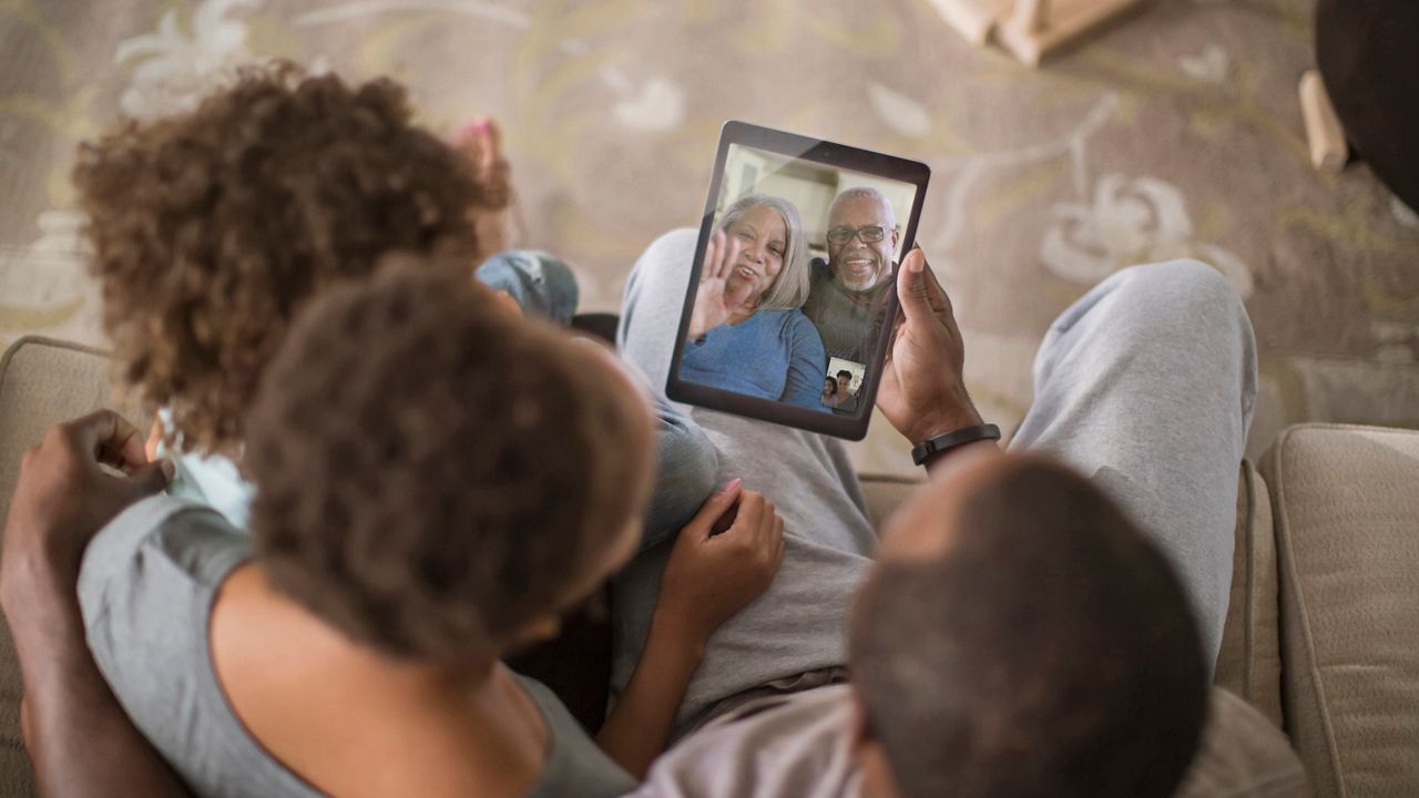 Family video chatting with digital tablet