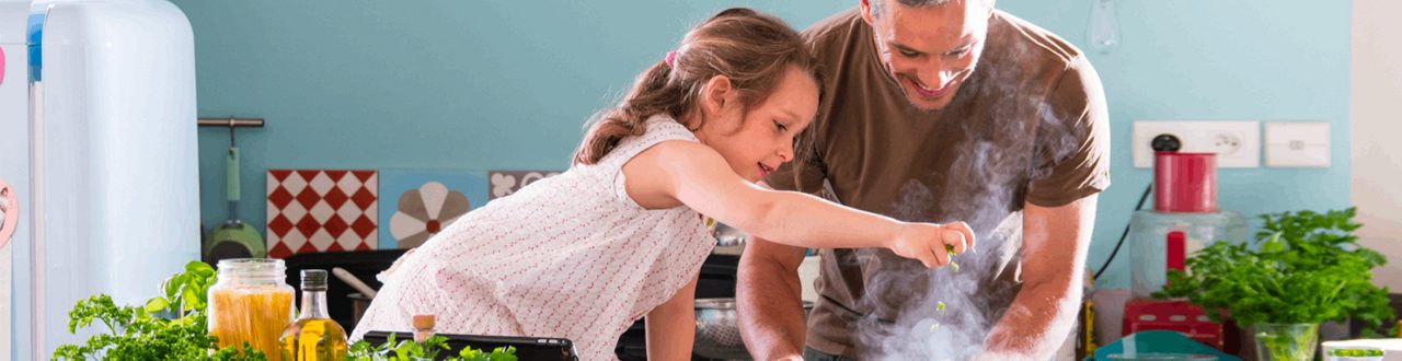 Parent and child preparing food