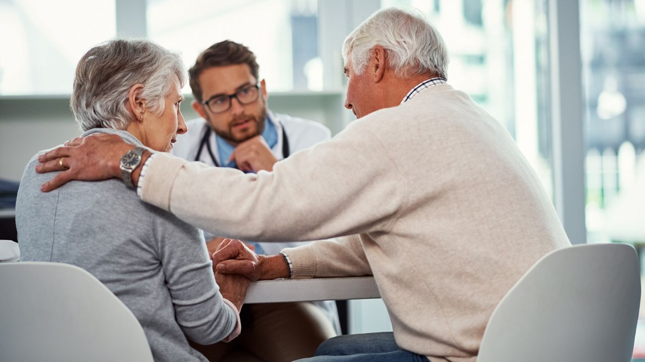 Comfort, senior couple and doctor in consultation, cancer diagnosis and empathy for medical condition. Support, elderly people and physician with bad news for disease, console or compassion in clinic.