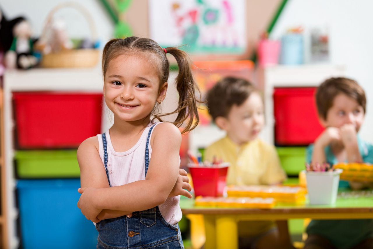 Little girl posing in classroom.