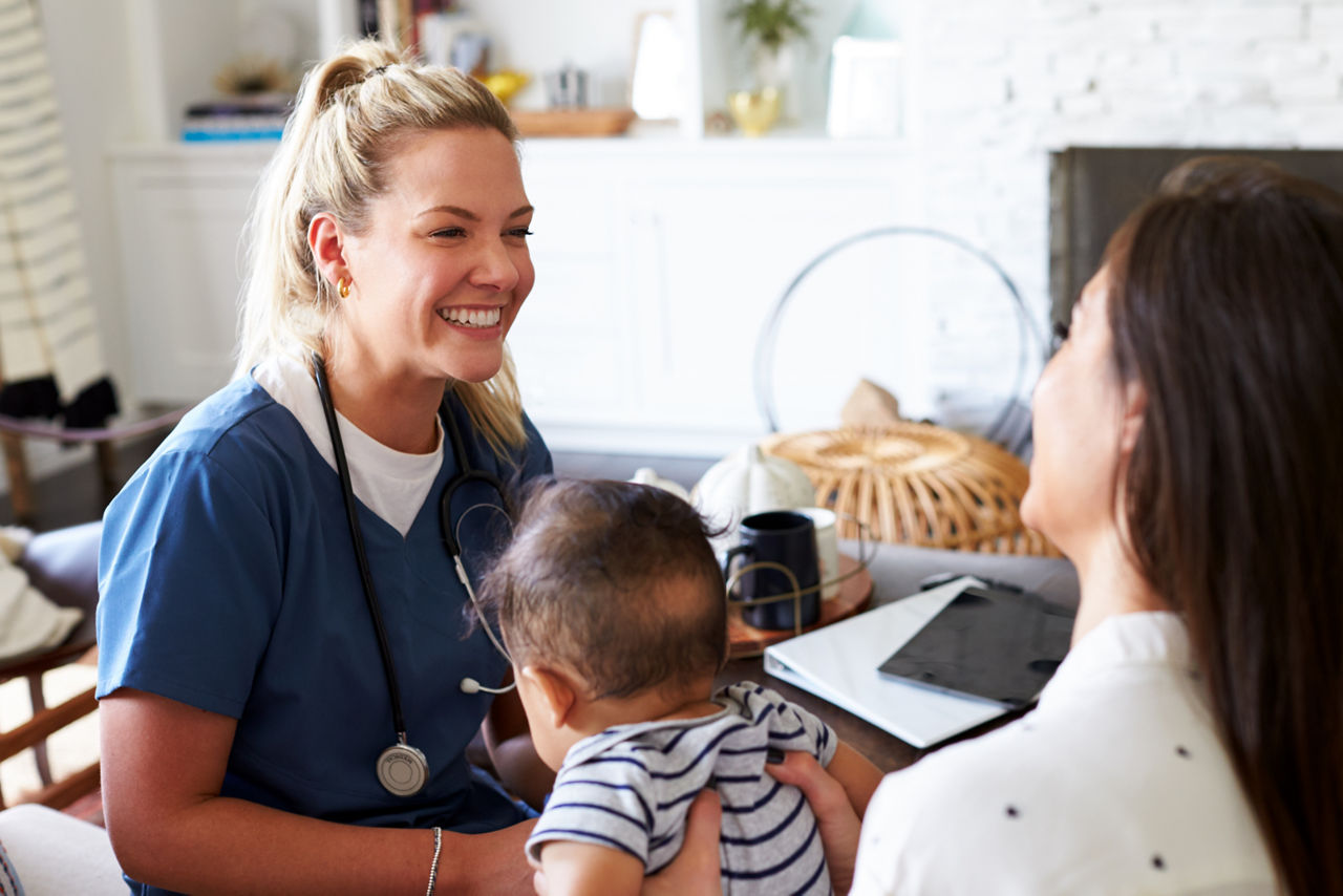 Mother and baby visiting a health care professional