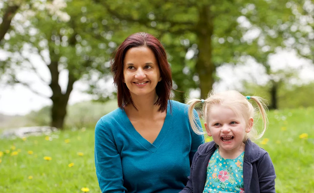 mother-and-daughter-sitting-on-bench-new