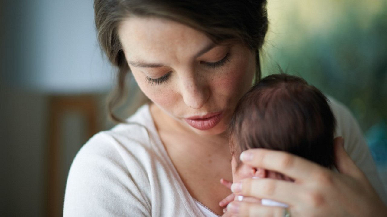 Mother and baby at GP consultation