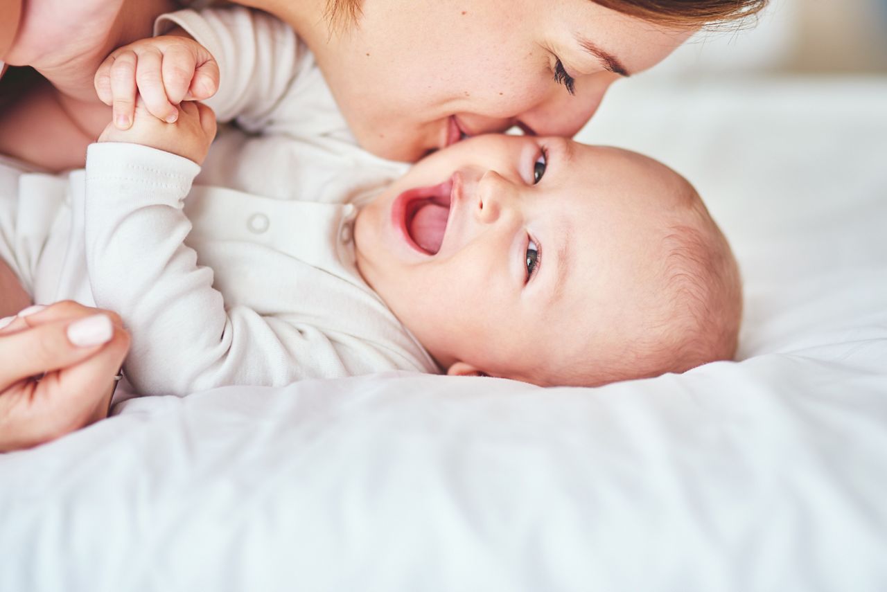 Shot of a young mother bonding with her adorable baby boy at home