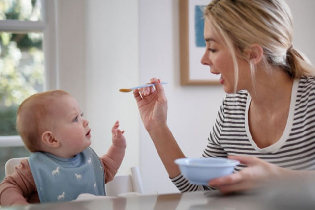 mother-spoonfeeding-baby