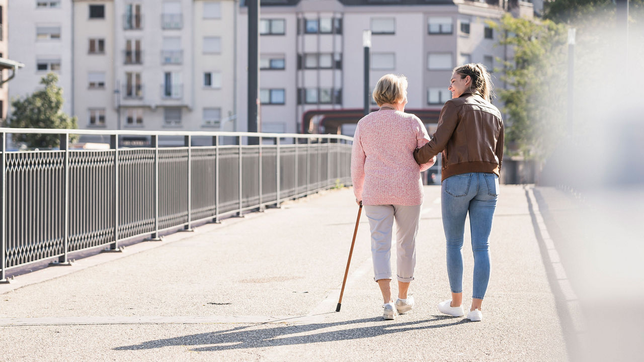 mum-and-daughter-walk-over-bridge-3840-2160.jpg