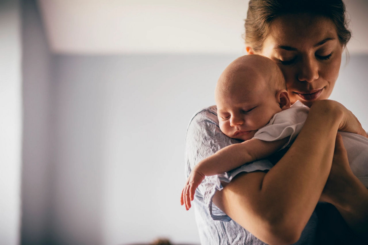 Mum holding baby night