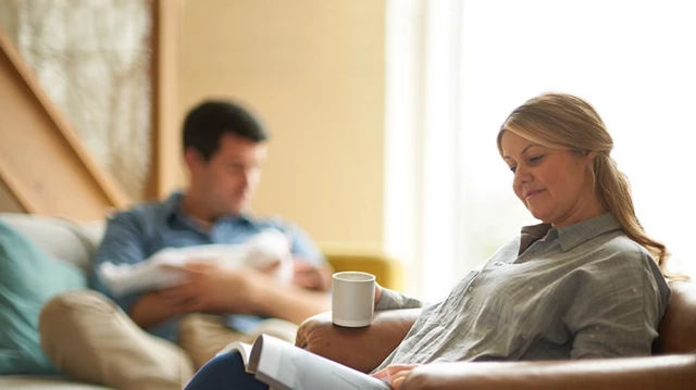 Mum relaxing with a magazine