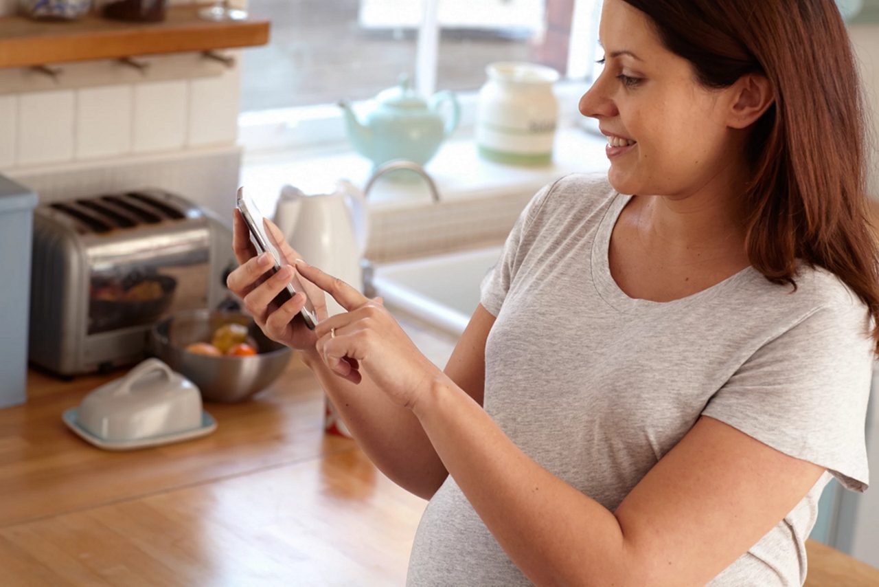 mum-to-be-checking-her-phone