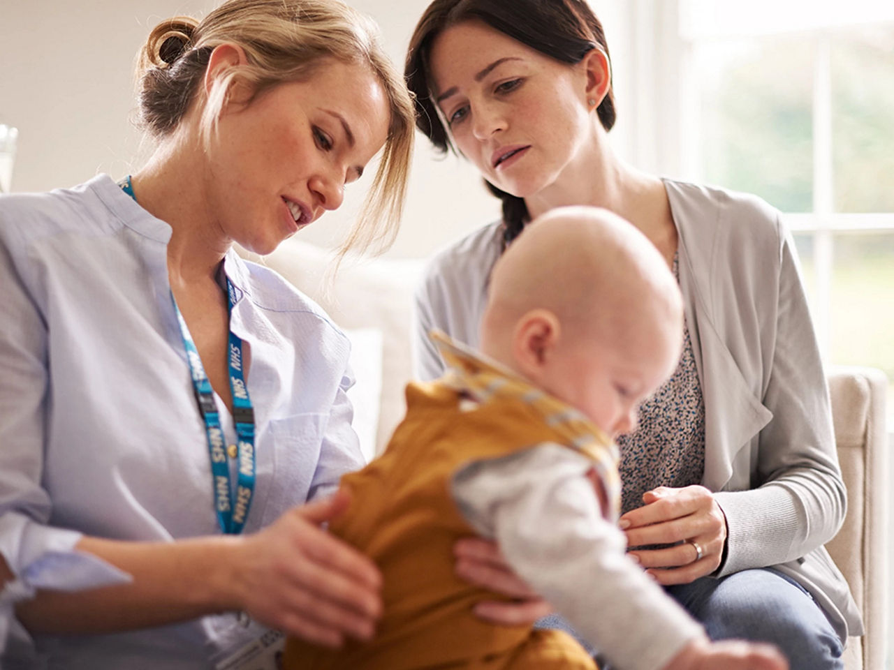 two-women-with-baby