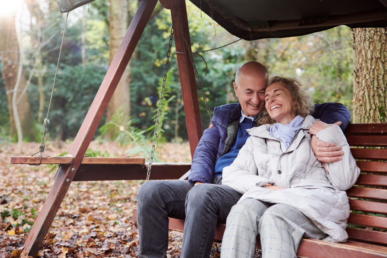 Nutricia eldery couple sitting on garden bench