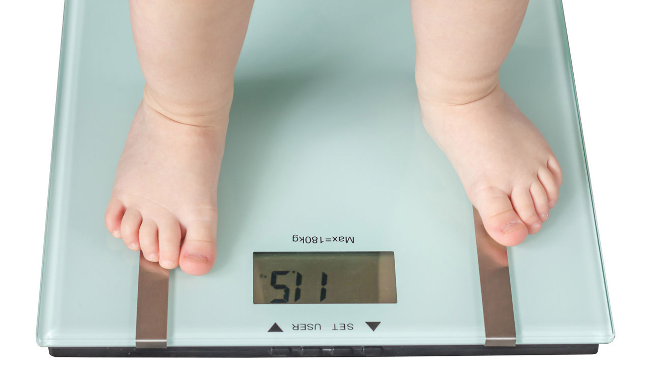 Close up of a toddler's feet on a scale