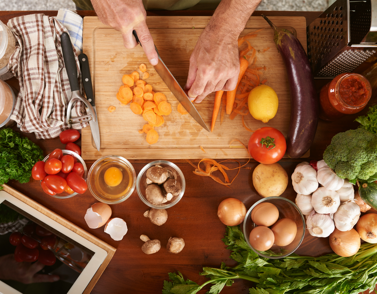 Nutricia Metabolic Chopping Carrots in a Kitchen Setting
