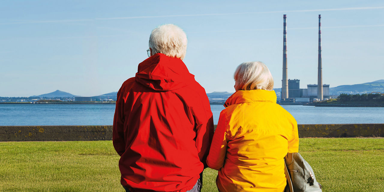 Cyclist woman enjoys her adventures and the landscape of the Dublin chimneys and the mountains