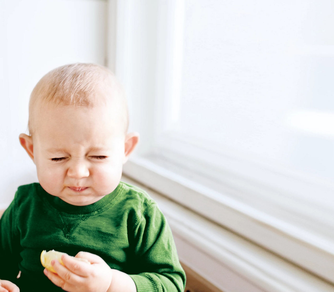 Baby eating a lemon