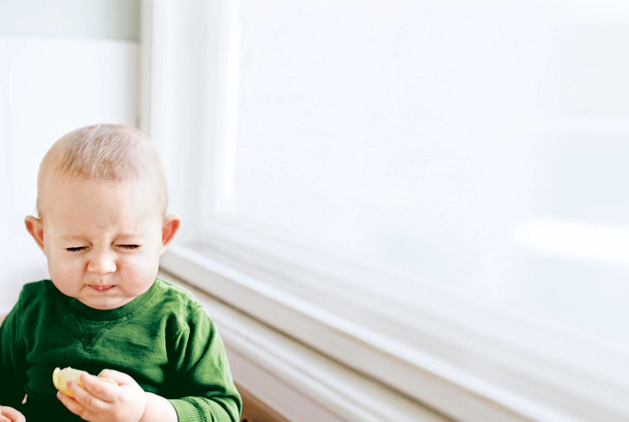 Toddler eating with fork