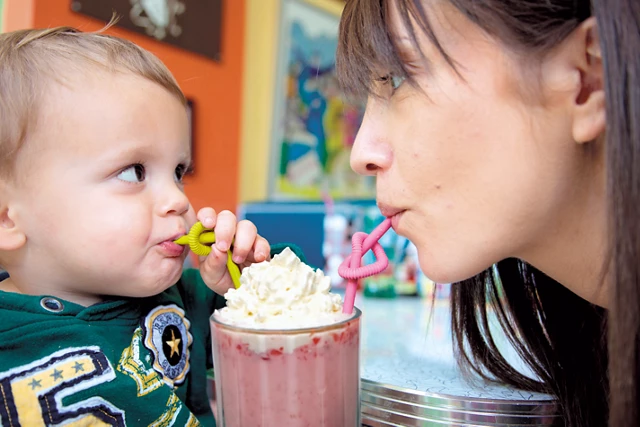 mom and baby drinking milkshake