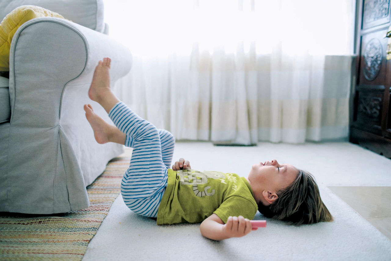 Baby laying down on the floor