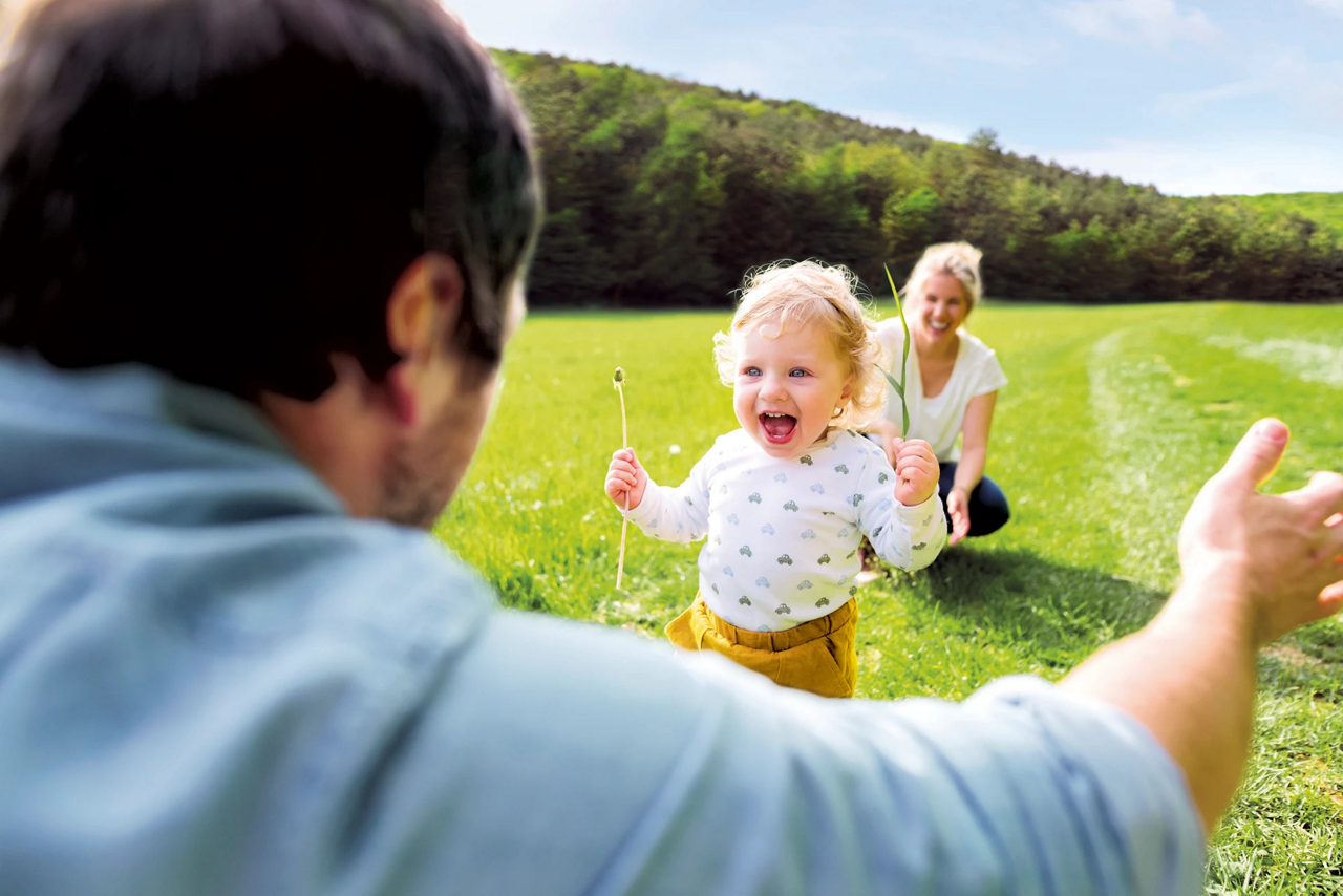 toddler running into a dads hug