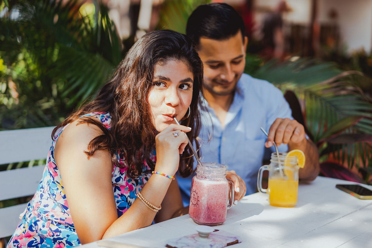 Couple sipping juice