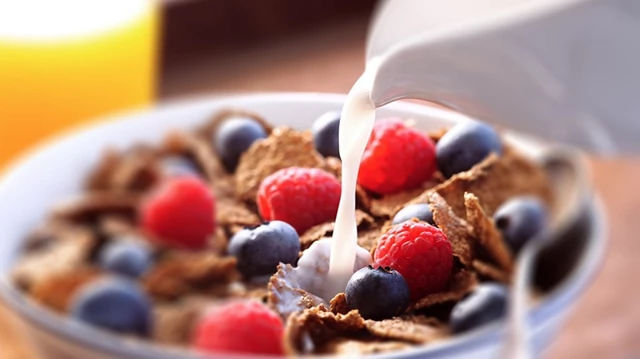 Pouring Milk Into Cereal