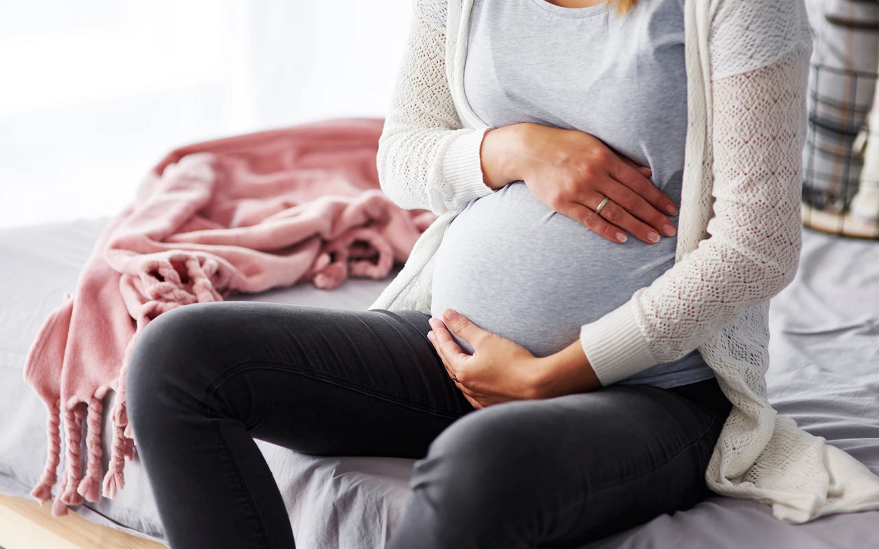 Expectant mother feeling bump