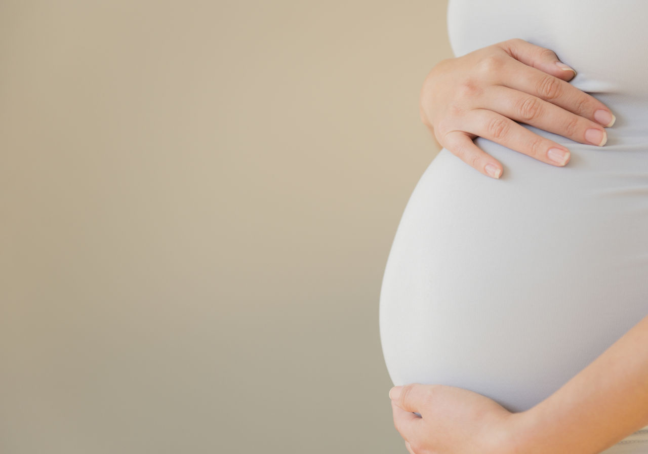 Close-up of pregnant woman's belly; Shutterstock ID 314492030,pregnant womans bump