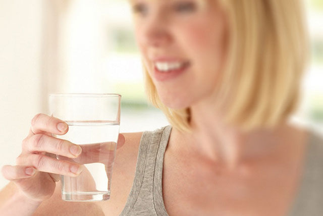 pregnant woman drinking water