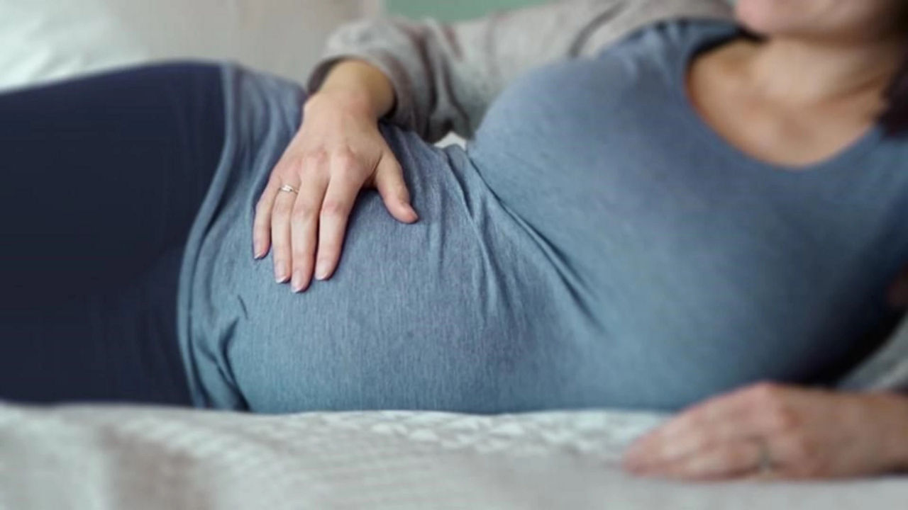 Pregnant woman lying on her side