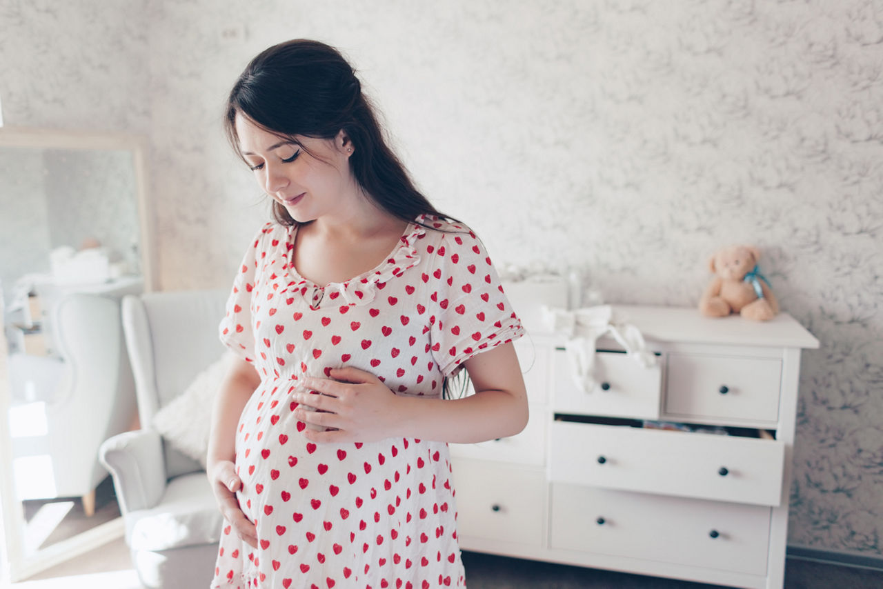 Home portrait of young pregnant woman standing at nursery; Shutterstock ID 374586466,pregnant woman standing in nursery