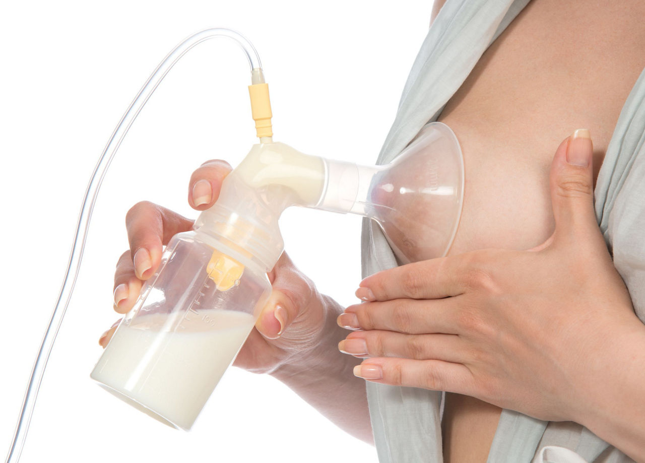 21262107 - new compact electric breast pump to increase milk supply for breastfeeding mother isolated on white background
