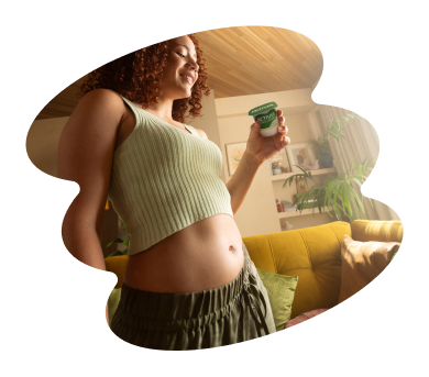 Smiling woman holding Activia yogurt