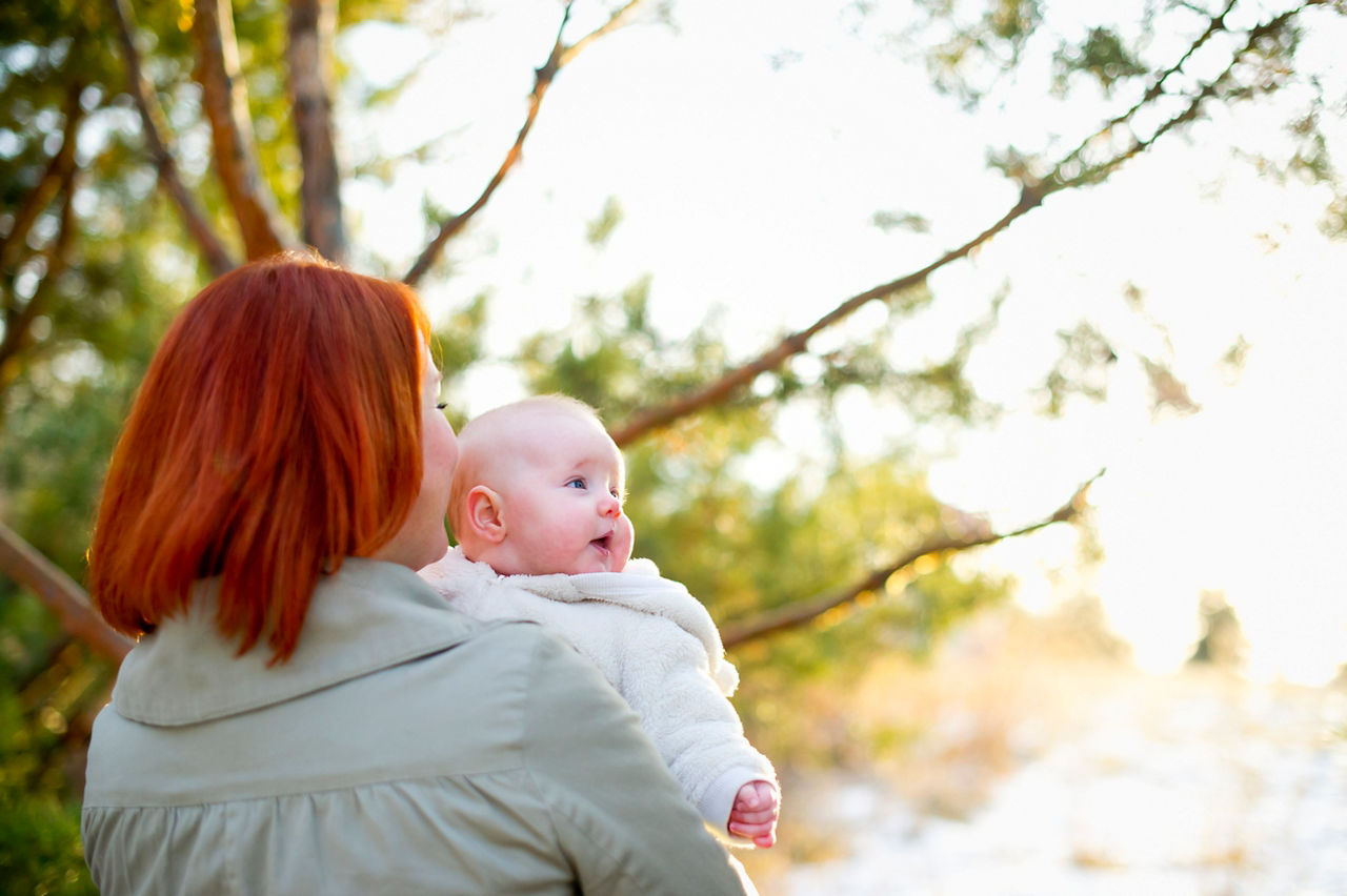 Redhaired mum baby outside