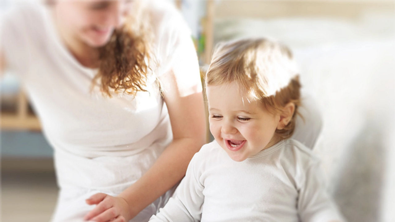 Baby crawling on bed