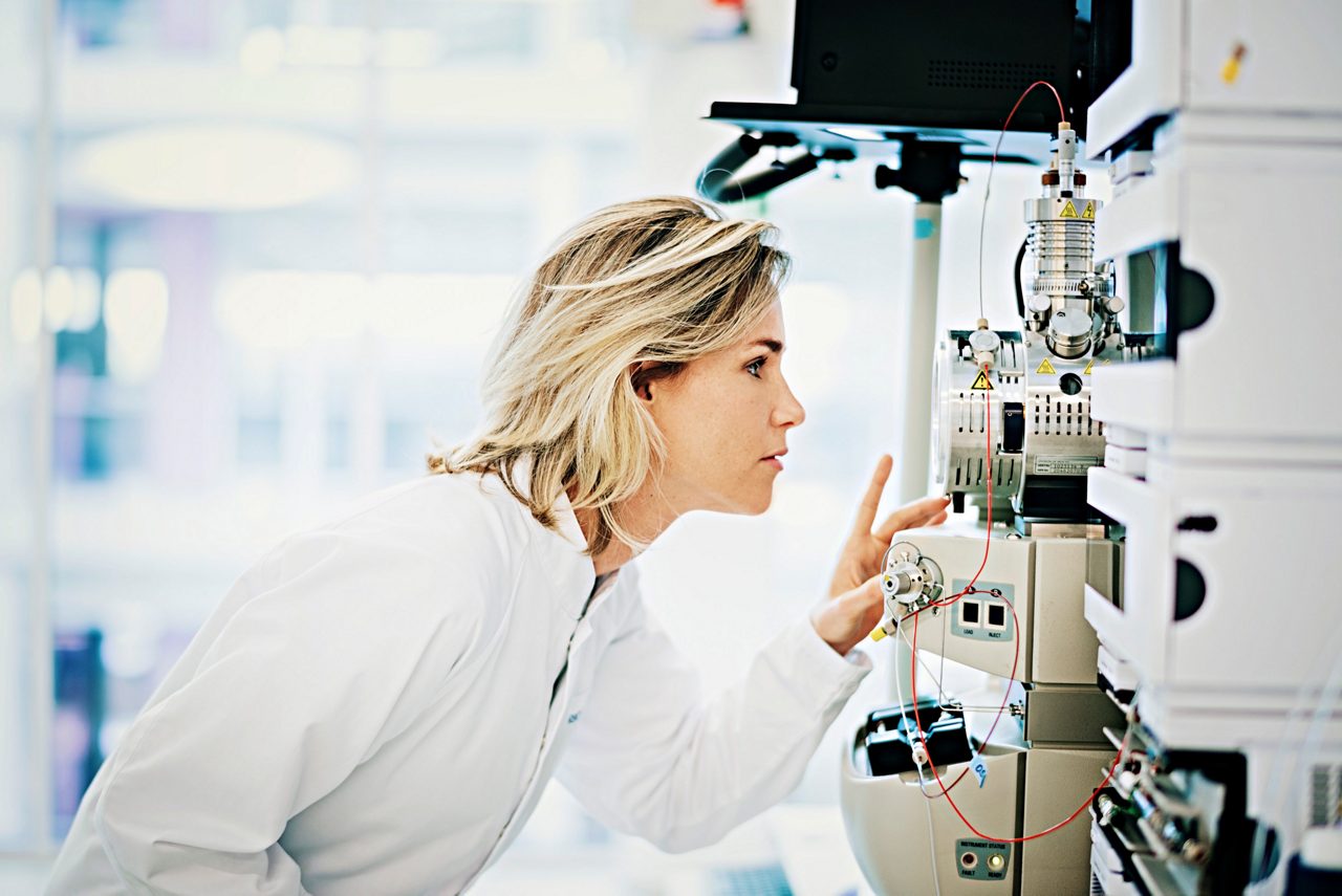 Scientist checking test