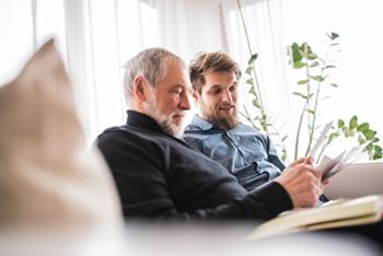 Hipster son and his senior father at home.; Shutterstock ID 1054765004; purchase_order: DNC Thumbnails; job: Webinars 2 (50/188); client: ; other: 