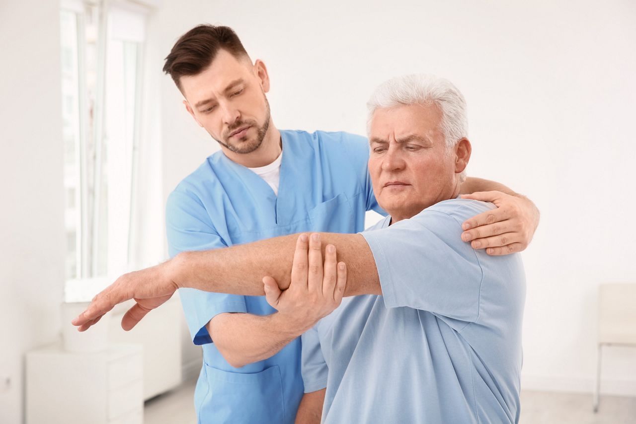 Young physiotherapist working with senior patient in clinic; Shutterstock ID 1073345978; purchase_order: DNC Thumbnails; job: Publications; client: ; other: 